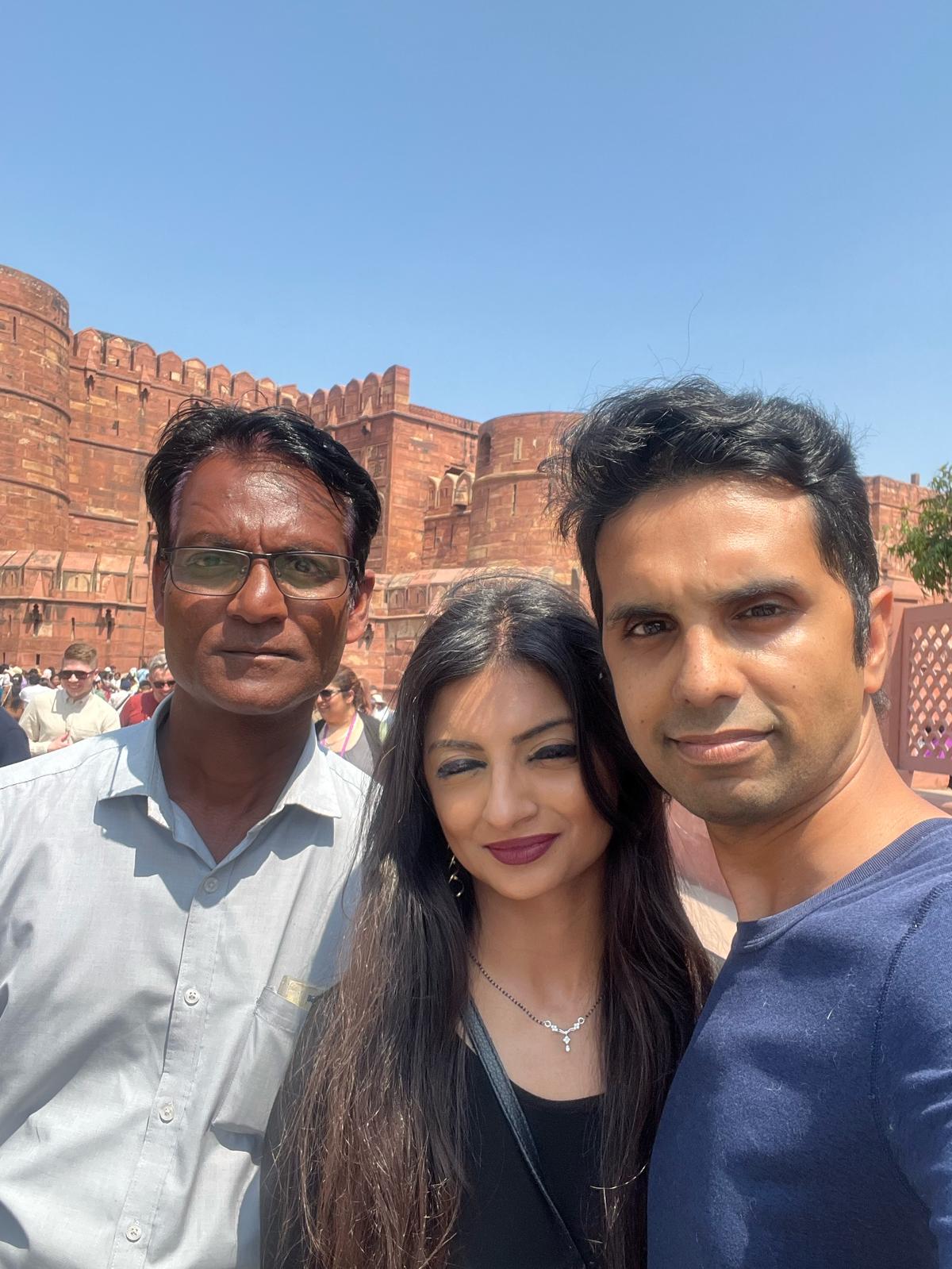 Mr. Verma with tourists smiling